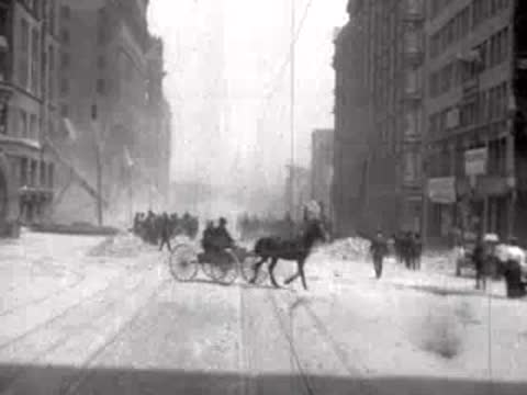 horse-drawn carriage and pedestrians on city street, historical footage