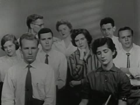 Audience of students seated in a classroom looking attentive