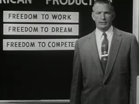 Man standing before a completed production chart, 1950s film