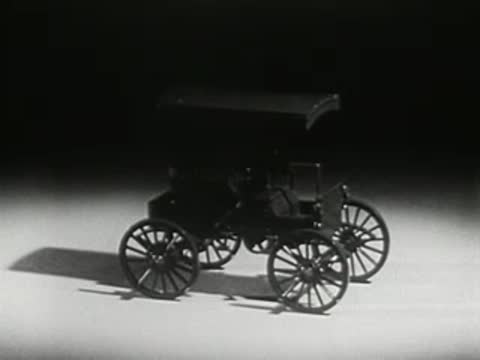Vintage antique car standing on a stage, 1950s archival footage