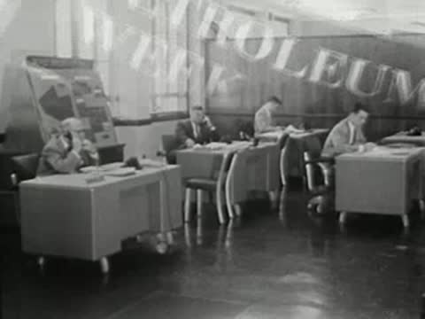 wide view of office workers at desks with overlaid text headings like petroleum week