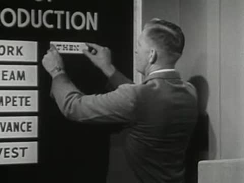 man in suit adding a text strip and horse icon to a board on set