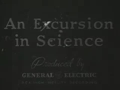 Title card fading out over a laboratory apparatus background.