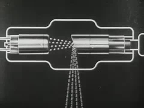 Animated diagram of X-ray tube alongside lecturer presenting in front of screen.