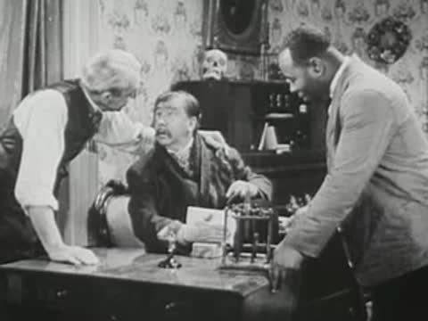 Three men in historical attire talking and examining equipment together.