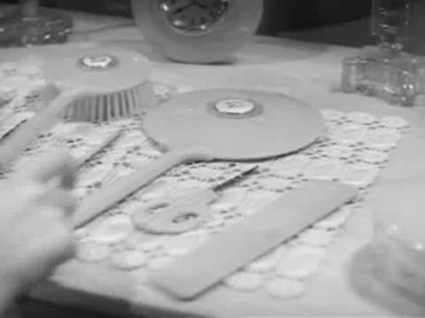 Dressing table with mirror, clock, and brush set, 1940s bedroom