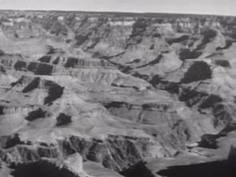 Aerial view of a vast canyon landscape, rugged terrain