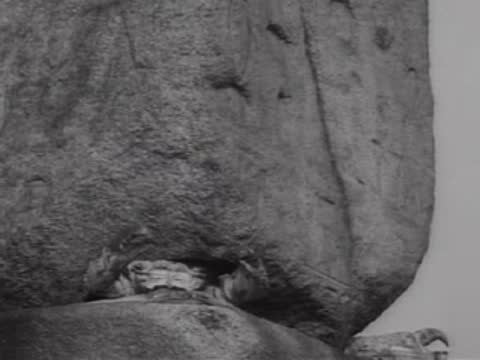 Close-up of a large natural boulder formation outdoors.