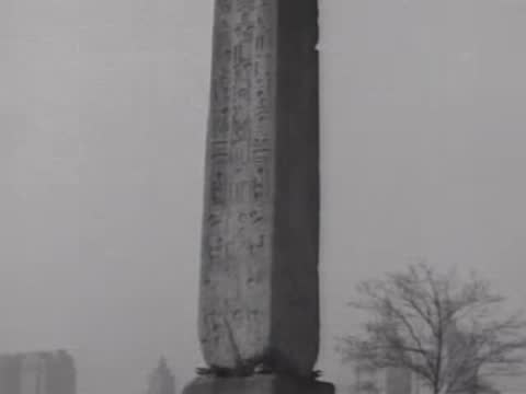 Close-up views of ancient hieroglyphs carved into a stone obelisk.