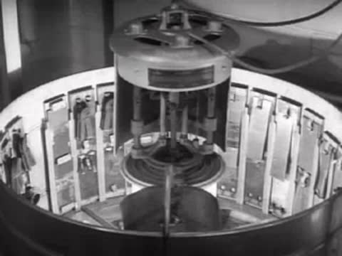 The rotary weathering apparatus running with test panels inside the chamber.