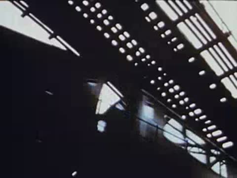 looking up at the el train tracks and overhead structure from below