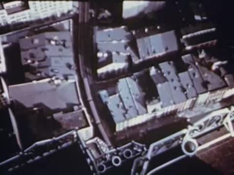 aerial view of rooftops and buildings from the el train