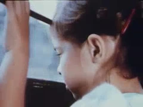 profile of a young girl looking out of a train window