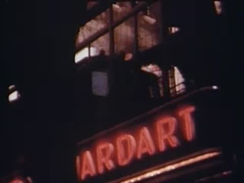 close-up of an illuminated sign reading ARDART from train window