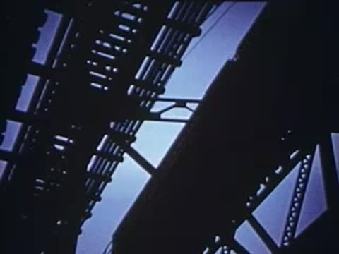 view looking up at the metal framework of the elevated tracks