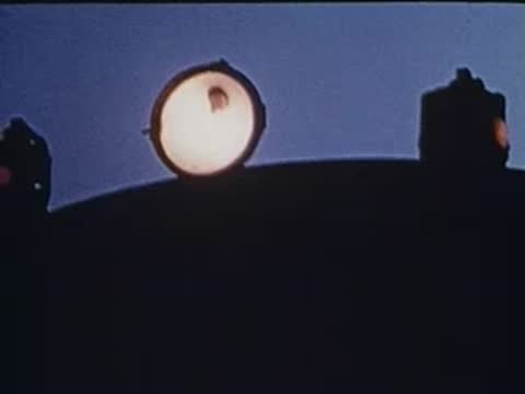 headlight of a train against a dark sky