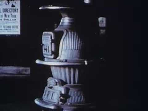 Ornate decorative panels and ironwork inside train or building, archival footage.