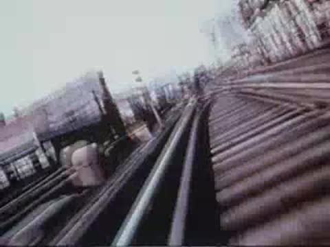 train tracks converging and splitting ahead from moving train