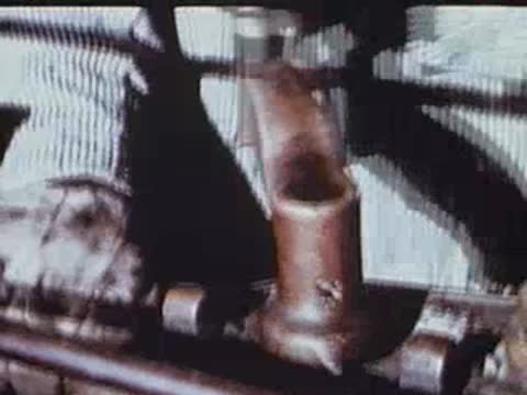 Close-up of a person's hands operating train controls.