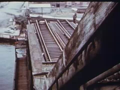 looking down from the el train at the bridge and water
