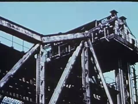 bridge structure lifting upwards as seen from the el train