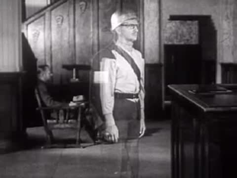 A man in a hat transitions visually into a soldier in uniform, trick effect.