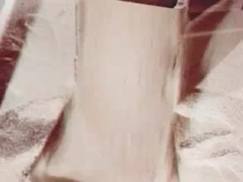 Grain pouring into a container on a dairy farm
