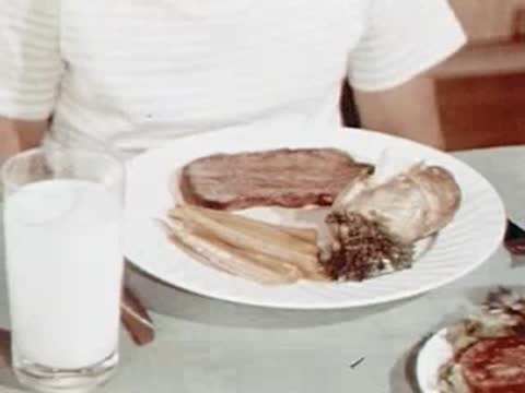 Close-up of a dinner plate with meat and vegetables.