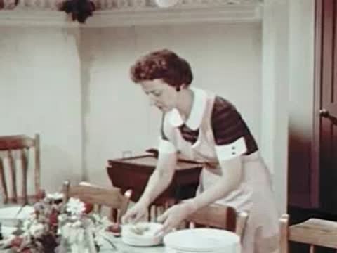 Woman preparing food in a kitchen, mid-century interior