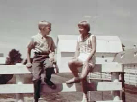 A girl in bed, then two kids sitting on a fence waving.