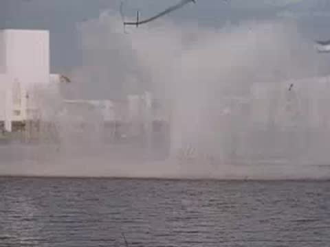 Water fountains operating in front of white exposition buildings