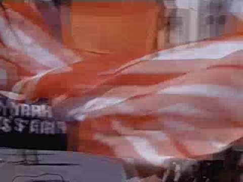 Large orange and blue New York World's Fair flag waving outdoors