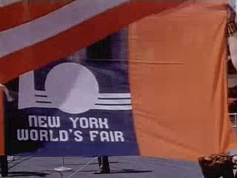 Waving New York World's Fair banner against a bright sky