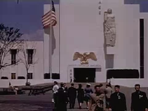 Visitors walking outside the pavilion of the United States of America