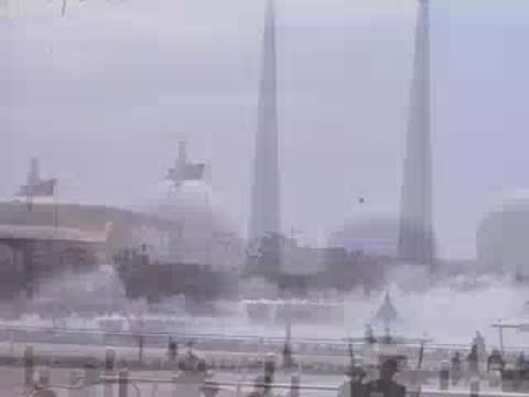 Wide shot of water fountains with the Trylon and Perisphere structures in the background.