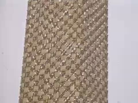 A close-up shot of a textured architectural column outdoors.