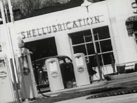 Shellubrication gas station with vintage fuel pumps and car