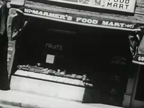 Co-Op storefront and Marmer's Food Mart with fruit displays