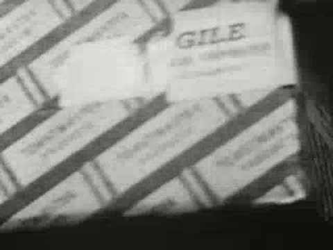 Stack of packaged boxes labeled 'Fragile' and 'Toastmaster', vintage shipping footage.