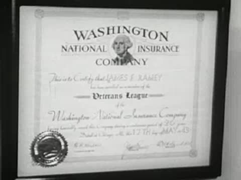 Washington National Insurance Company certificate on wall, 1940s.