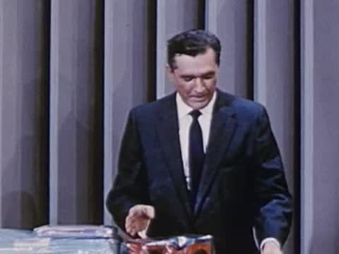 man opening a product box on a table surface