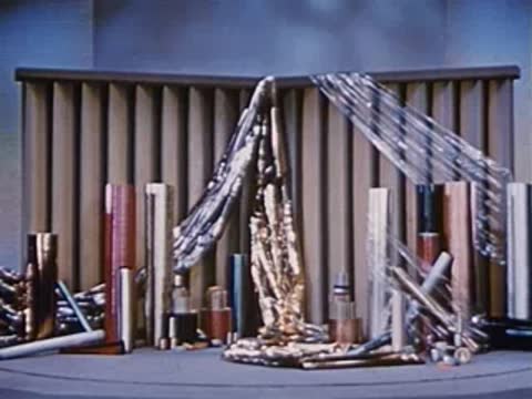 Close-up of display setup with various materials and metallic tinsel