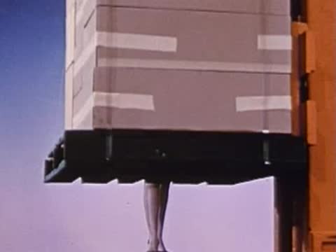 low angle shot of a forklift lifting a stack of boxes
