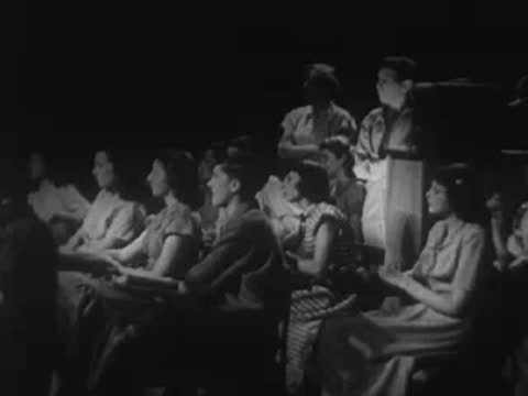 Students in a classroom setting during a lecture or presentation.