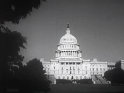 Exterior view of the United States Capitol building illuminated.