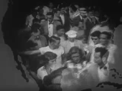 Dense crowd of people outdoors, overlaid with a silhouette of a map.