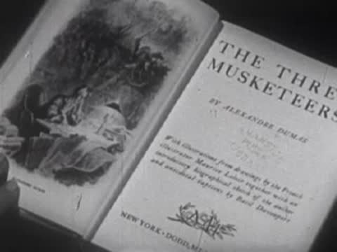 Open classic literature books showing title pages: The Three Musketeers, Gulliver's Travels