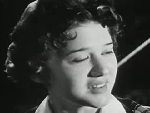 Close-up of a young woman talking and smiling