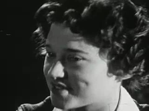 Close-up of a young woman talking and smiling