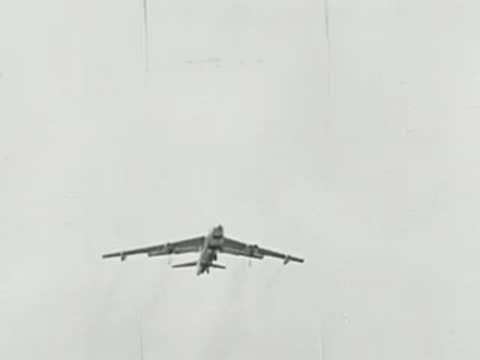 B-52 bombers flying in formation over sky, historical footage